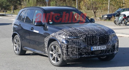 Spy shots of the 2024 BMW X5 reveal new lights and minor changes to the front fascia