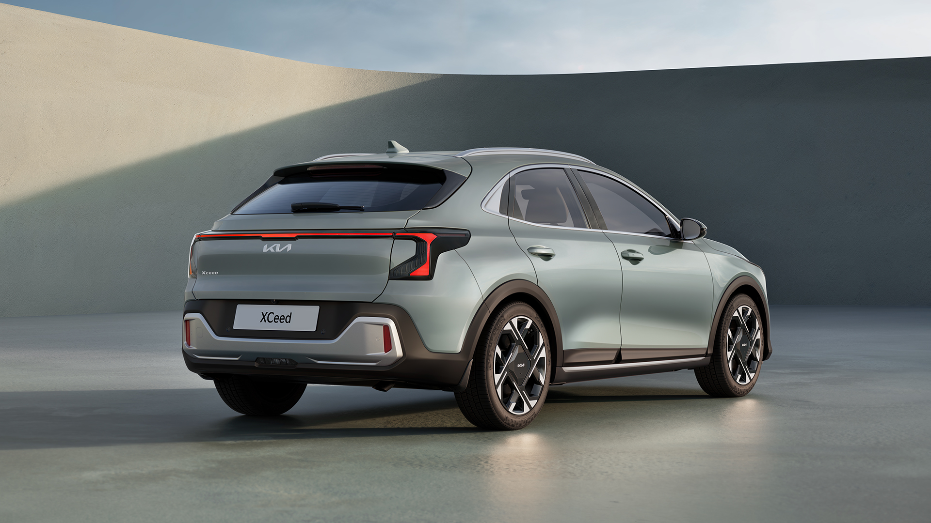 The 2026 Kia XCeed drops the tiger-nose grille in favor of Kia's newer Opposites United design language, with vertical LED headlights and a reshaped front bumper.
